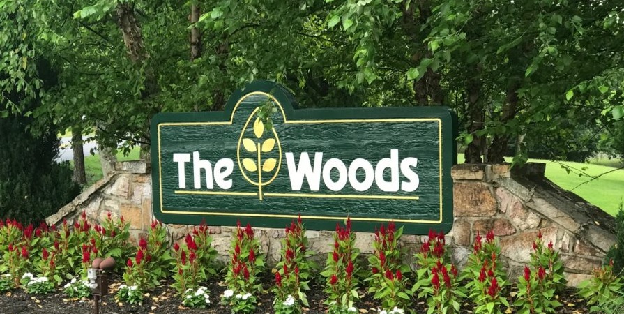 The Woods Sign in the Spring